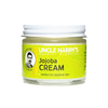 Small glass jar with white lid containing handcrafted jojoba cream moisturizer for sensitive skin, labeled with bright yellow USA Made Health & Wellness branding.