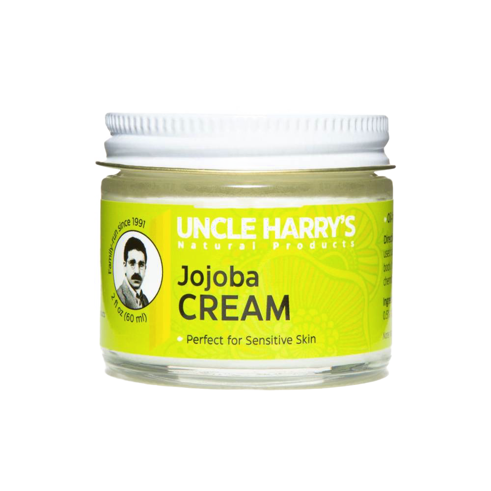Small glass jar with white lid containing handcrafted jojoba cream moisturizer for sensitive skin, labeled with bright yellow USA Made Health & Wellness branding.