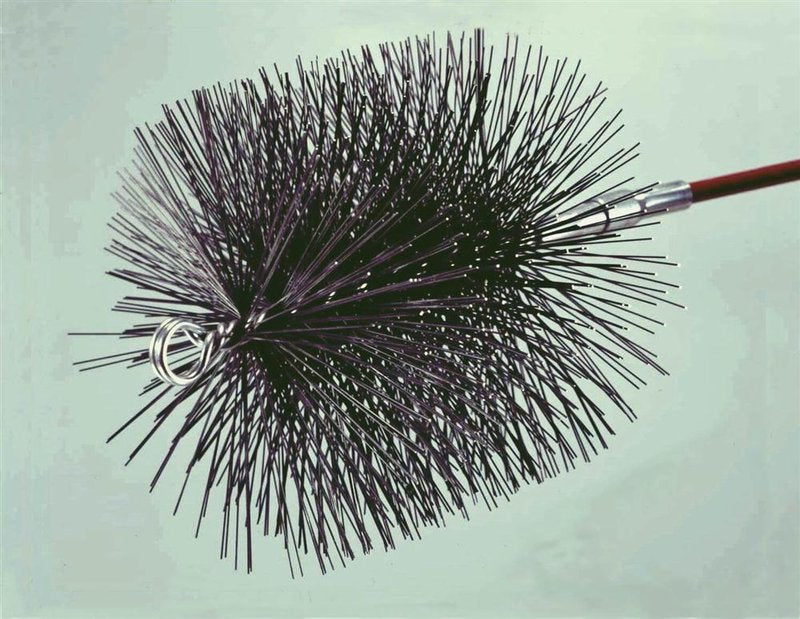 Handcrafted round chimney brush with dense wire bristles designed to fit snugly in stovepipes, ideal for hearth maintenance and included in best sellers and hearth accessories collections.