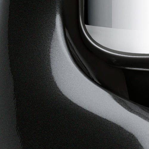 Close-up detail of a glossy black enamel surface with a polished stainless steel bowl edge, highlighting the craftsmanship of a durable kitchen mixer for Baking Supplies and Kitchen Gadgets collections.
