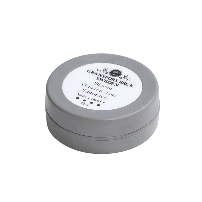 Compact round ceramic grinding stone in a gray container, handcrafted in Sweden, suitable for Farm, Garden & Tool, Knives & Axes, Accessories & Maintenance, and Best Sellers collections.