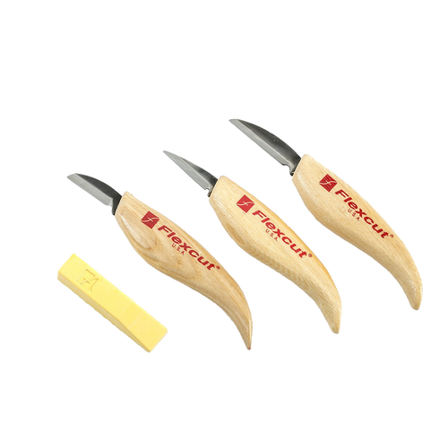 Set of three flexible carving knives with ergonomic wooden handles branded FlexCut and a yellow sharpening compound, handcrafted in USA, featured in carving knives and homesteading collections.