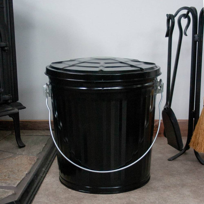 Black painted steel ash pail with a secure lid and strong metal bail handle, handcrafted for long-lasting use in Stoves, Hearth Accessories, Best Sellers, and Promo Eligible collections.