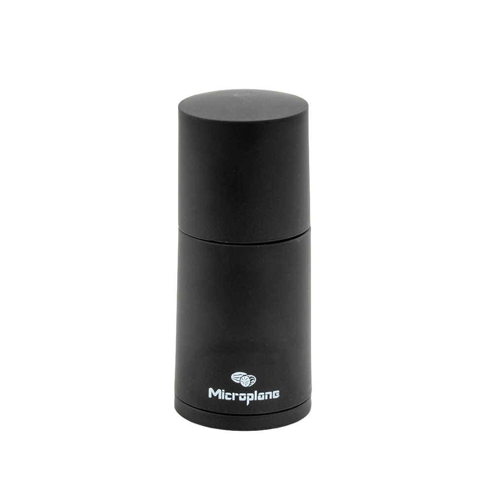 Matte black compact spice grinder for fresh cinnamon and nutmeg, featuring sturdy blades and a sleek design, ideal for Kitchen & Food, Brewing Coffee and Tea, and Best Sellers collections.