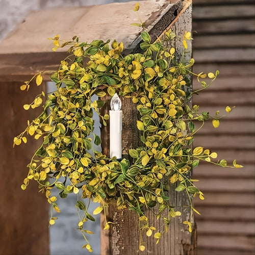 Handcrafted wreath with yellow-green leaves surrounding a warm white LED taper candle clipped to rustic wood, perfect for Home & Decor, Holiday Decor, Best Sellers, and Promo Eligible collections.