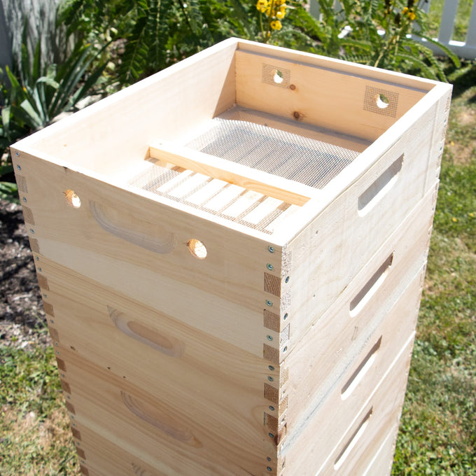 Handcrafted wooden winter hive topper with ventilation screens and dovetail joints, Amish made in the USA, designed to control moisture and protect bees in farm and beekeeping collections.