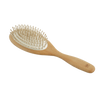 Handcrafted large wooden hairbrush with smooth olive wood handle and nine rows of gentle hornbeam pins, designed for soothing scalp care, featured in Health & Wellness and Grooming collections.