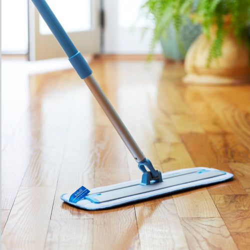 Telescoping handle mop with plush cleaning pad gliding over a polished hardwood floor, ideal for household cleaning and best sellers in Home & Decor and Cleaning Utensils collections.