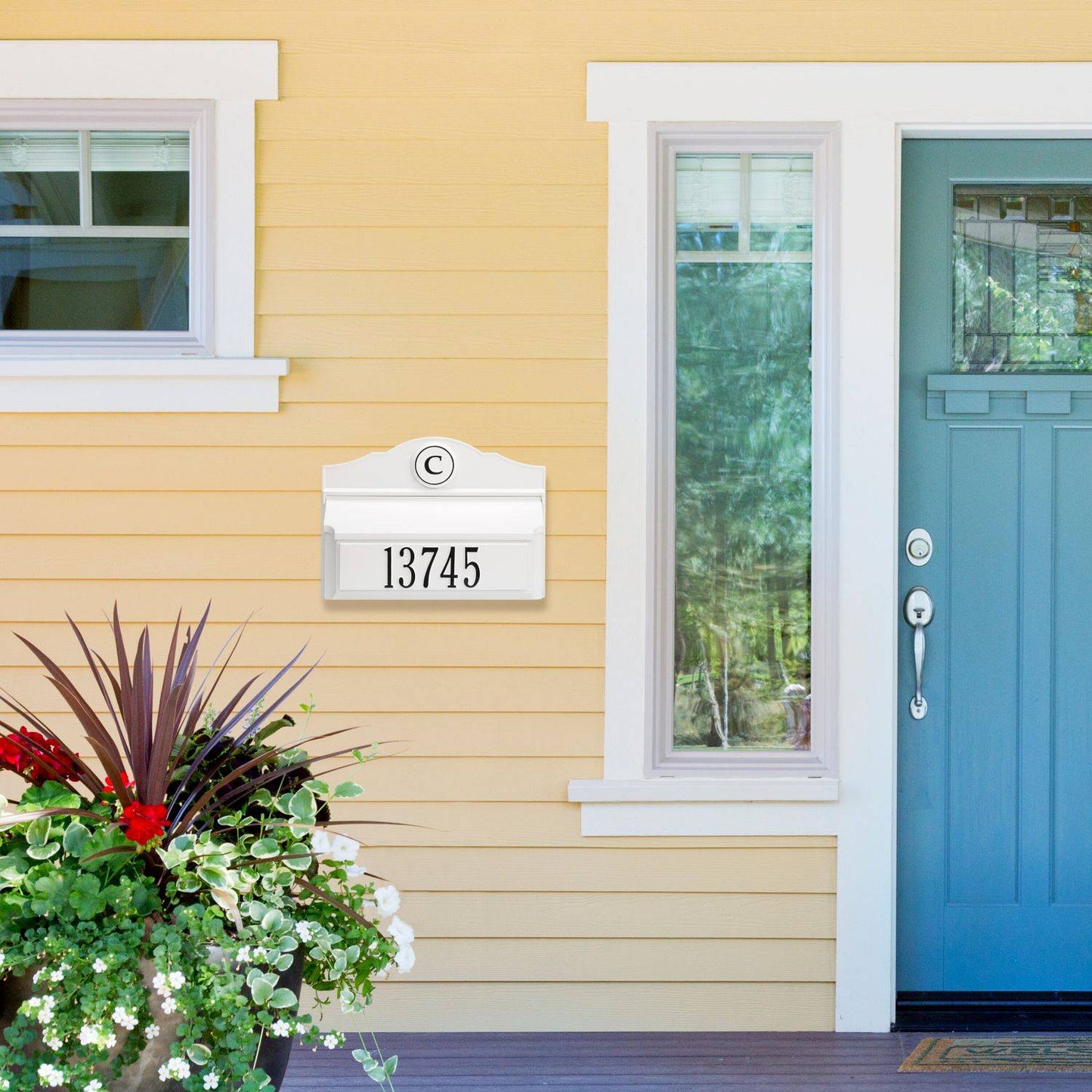 Handcrafted white and black wall mount mailbox with custom monogram and house number, enhancing curb appeal on a yellow home exterior, featured in Home & Decor, Mailboxes and Address Signs, USA Made, and Best Sellers collections.