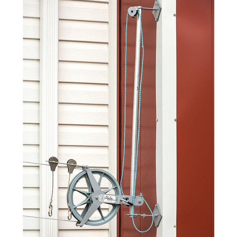 Galvanized steel elevator pole equipped with a pulley and nylon rope system, handcrafted and Amish made in the USA, designed for raising clotheslines in home and laundry settings.