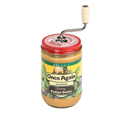 Old fashioned peanut butter stirrer with molded cream-colored knob and metal crank attached to red lid on jar of natural peanut butter, handcrafted in USA, ideal for Kitchen & Food, Food Prep, Kitchen Gadgets, Kitchen Accessories, USA Made, Best Sellers, and Promo Eligible collections.