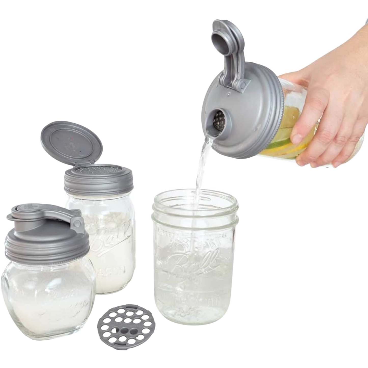 Clear glass mason jars fitted with gray reusable lids in a zero waste starter set, showing one jar pouring liquid, ideal for Home & Decor, Household Helpers, and Best Sellers collections.