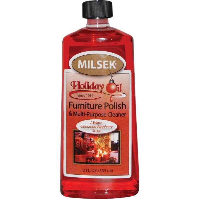 Clear plastic bottle of red liquid wood furniture polish and multi-purpose cleaner with black cap and warm cinnamon-raspberry scent, suitable for Home & Decor, Household Cleaning, and USA Made collections.