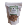 Resealable white pouch with caramelized black walnut nuggets visible through a clear window, featuring a green and white label, part of Kitchen & Food, Snacks and Sweets, Pantry, USA Made, and Best Sellers collections.