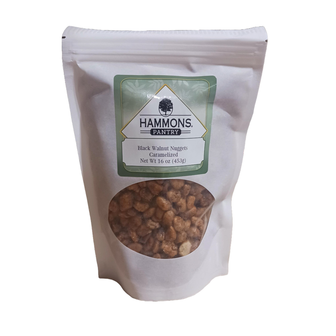Resealable white pouch with caramelized black walnut nuggets visible through a clear window, featuring a green and white label, part of Kitchen & Food, Snacks and Sweets, Pantry, USA Made, and Best Sellers collections.