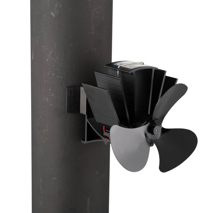 Black heat-powered stove fan with three broad blades and metal fins, designed to mount on a wood stove flue pipe, crafted to enhance warm air circulation in homes, featured in Hearth Accessories and Best Sellers collections.