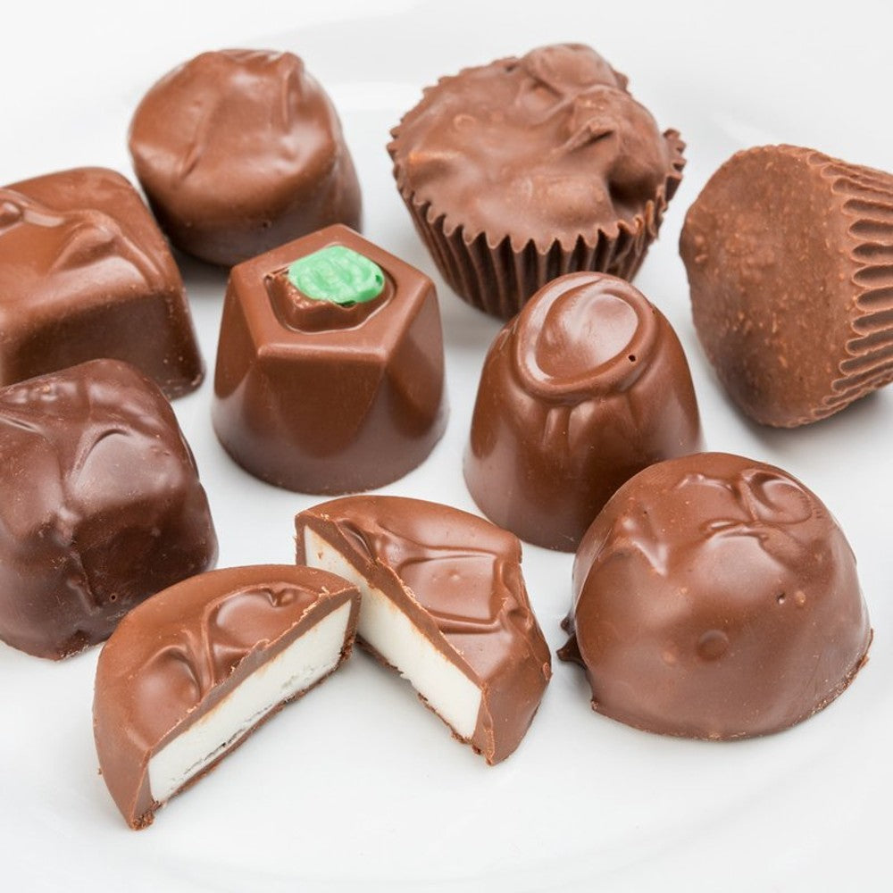 Assortment of handcrafted sugar-free chocolate pieces featuring smooth and textured varieties, showcasing creamy interiors, ideal for Kitchen & Food, Snacks and Sweets, Candy, and USA Made collections.