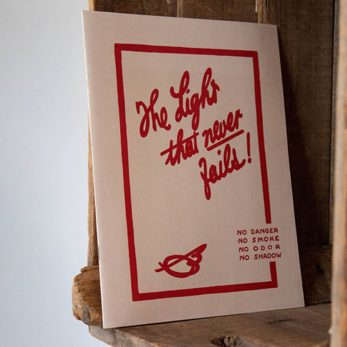 Paperback booklet with bold red hand-lettered text reading "The Light that never fails!" and safety notes, styled simply for heritage and lifestyle book collections.