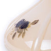 Close-up of a handcrafted glass lamp shade featuring a black rose decoration on a soft champagne background, ideal for Lamps & Lighting, Lamp Shades, and Parts and Accessories collections.