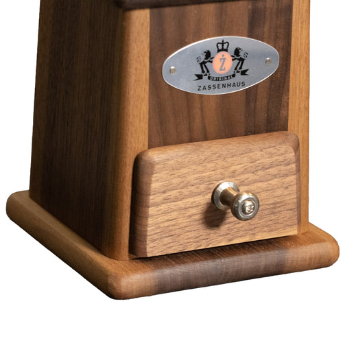 Close-up of a handcrafted walnut coffee grinder drawer with metal knob and branded plaque, ideal for Farm, Garden & Tool, Kitchen & Food, Brewing Coffee and Tea, and Best Sellers collections.