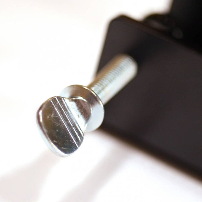 Close-up of a sturdy metal screw and knob on a handcrafted counter clamp designed to securely mount grain mills, part of USA Made Kitchen & Food and Bread Making Supplies collections.