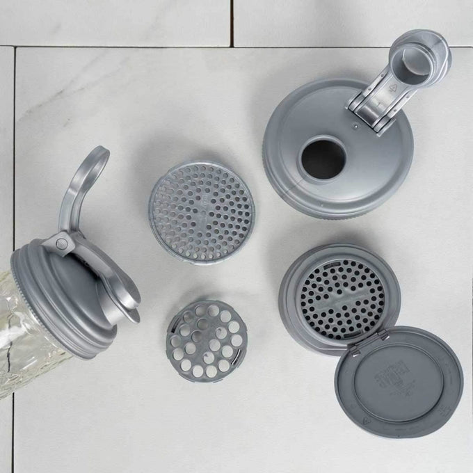 Six-piece set of gray reusable mason jar lids with pour and flip tops, including removable perforated inserts, designed as eco-friendly household helpers for Home & Decor and Best Sellers collections.