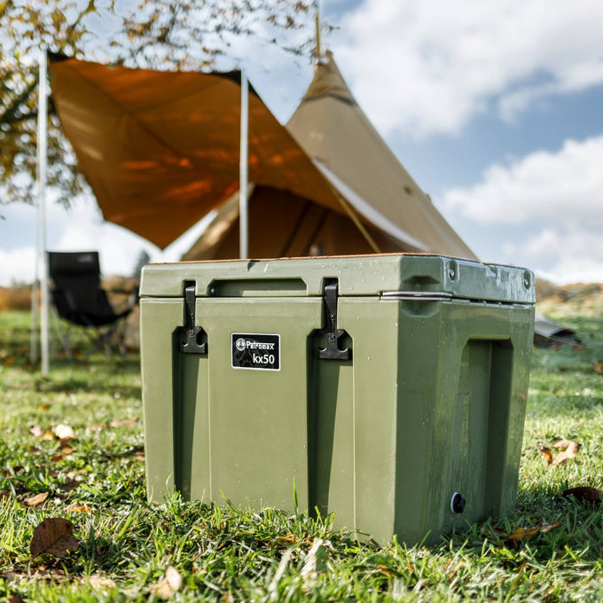 Olive green heavy-duty cooler box with secure latches and sturdy handle, set on grass outside a camping setup with a tent and chair in the background, ideal for outdoor adventures in Farm, Garden & Tool and Camping collections.
