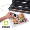 Hand using a vacuum sealer machine port to remove air from a clear reusable vacuum zipper bag filled with mixed nuts and candy, promoting food preservation and waste reduction in Kitchen & Food collections.