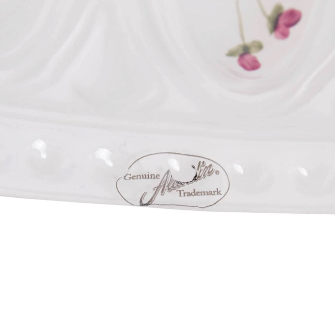 Close-up of the handcrafted Aladdin glass oil lamp shade edge featuring a subtle floral detail and embossed genuine trademark label, ideal for Lamps & Lighting and Lamp Shades collections.