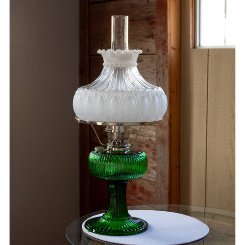 Vintage style oil lamp featuring a green glass base and a frosted glass shade with decorative patterns, perfect for lamps & lighting and parts and accessories collections.