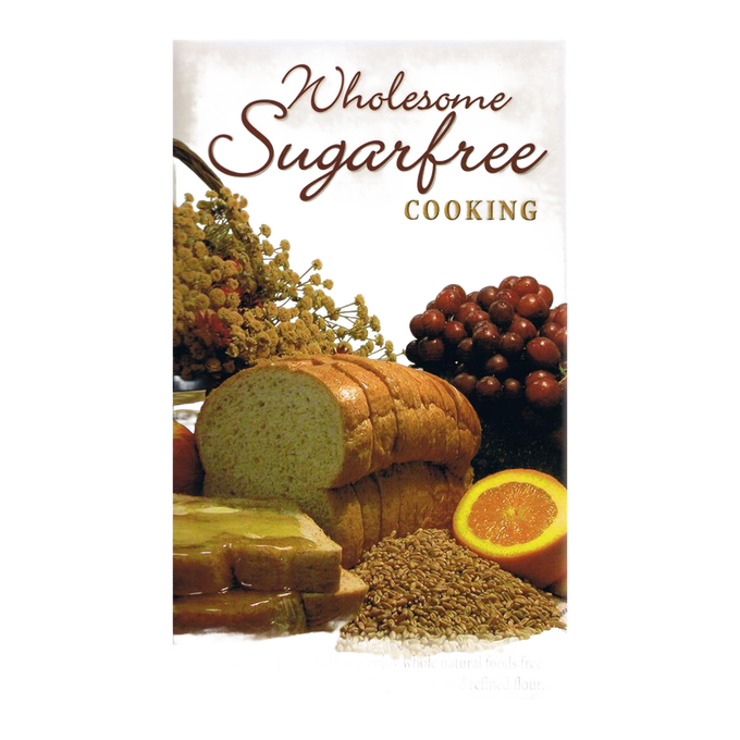 Cover of wholesome sugar-free cooking book featuring sliced bread, grapes, an orange half, honey dipper with comb, and wheat, highlighting health and wellness recipes in books and cookbooks collections.