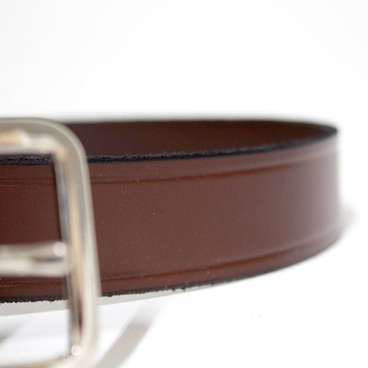 Close-up of a handcrafted Amish-made genuine cowhide leather belt in smooth brown with polished chrome buckle, featured in Health & Wellness, USA Made, Clothing and Accessories collections.