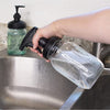 Set of two durable black pump and sprayer lids attached to clear mason jars being used at a kitchen sink, eco-friendly household helpers in Home & Decor, USA Made, and Best Sellers collections.