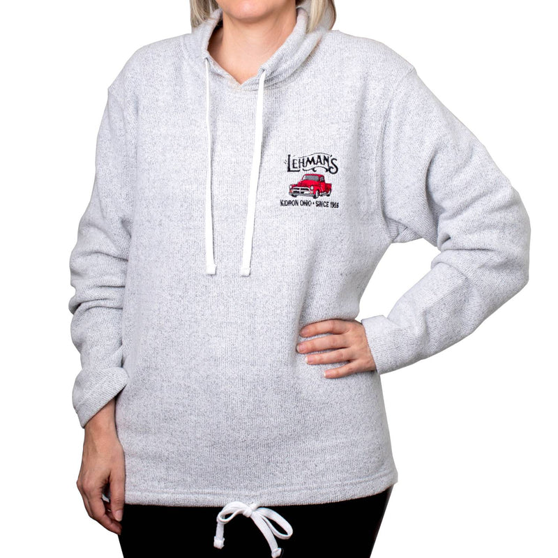 Person wearing a handcrafted light gray sweatshirt with a tunnel neck and adjustable cords, embroidered with a vintage red truck and Lehman’s logo, featured in Health & Wellness, Clothing and Accessories, Best Sellers, and Promo Eligible collections.