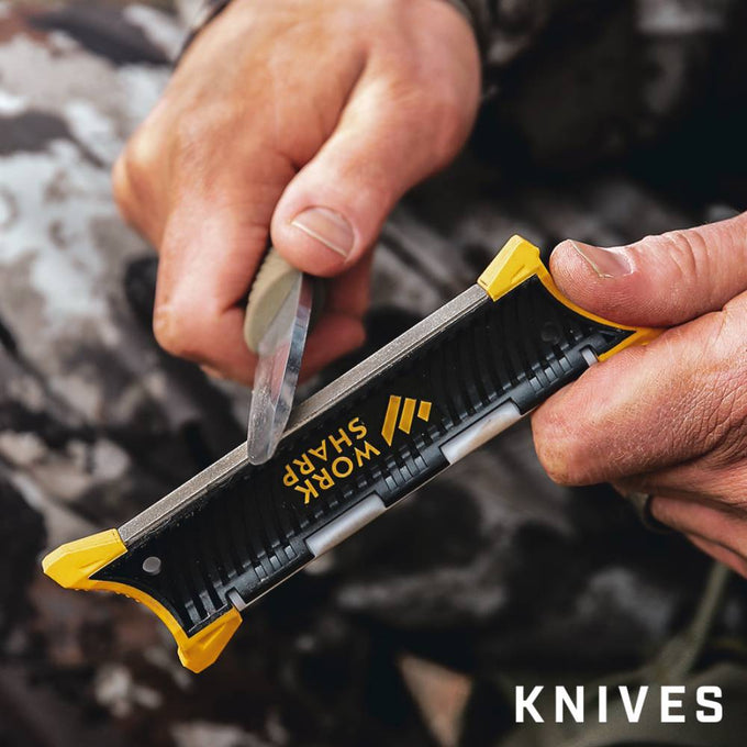 Hands using a compact Work Sharp Pocket Knife Sharpener with yellow corner grips to quickly sharpen a hunting blade, suited for Farm, Garden & Tool and Knives & Axes collections.