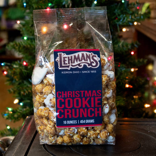 Clear bag of handcrafted caramel popcorn mixed with white chocolate peppermint bark and cookie pieces, ideal for Kitchen & Food, Snacks and Sweets, Popcorn, Best Sellers, and Promo Eligible collections.