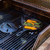 Small seasoned cast iron skillet on gas grill with fresh rosemary and orange peel, steaming under a vented lid, featured in Kitchen & Food, Cookware, Cast Iron, USA Made, and Best Sellers collections.