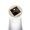 Close-up of the round solar panel and control button on top of a translucent inflatable solar candle, designed for outdoor use in camping, emergency supplies, and lighting collections.