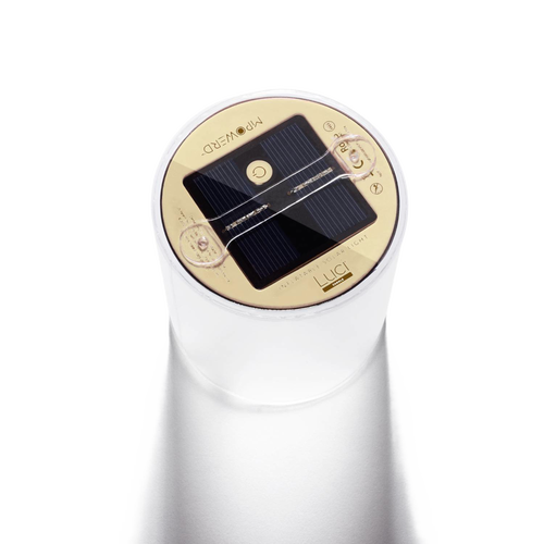 Close-up of the round solar panel and control button on top of a translucent inflatable solar candle, designed for outdoor use in camping, emergency supplies, and lighting collections.