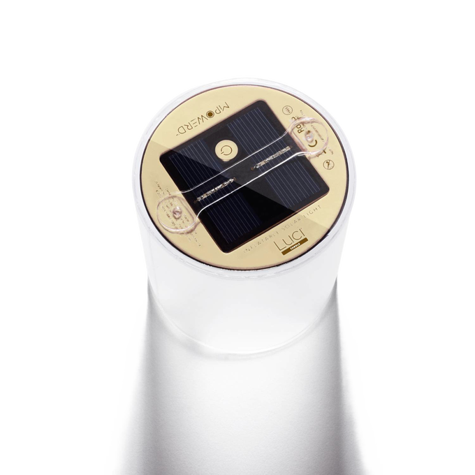 Close-up of the round solar panel and control button on top of a translucent inflatable solar candle, designed for outdoor use in camping, emergency supplies, and lighting collections.