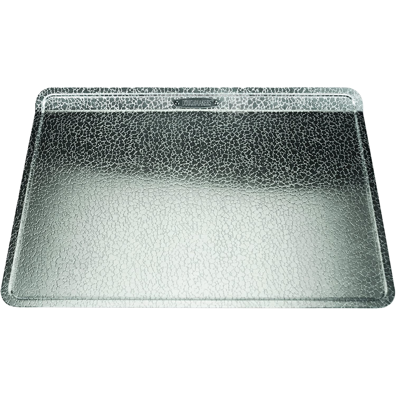 Heavy-gauge recycled aluminum baking sheet with textured pebble pattern to promote even browning and easy release, featured in Kitchen & Food, Cookware, Baking Supplies, Pots and Pans, Best Sellers, and Promo Eligible collections.