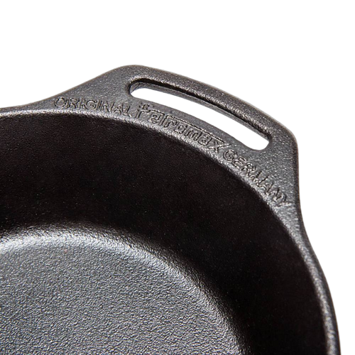 Close-up of a high-quality cast iron skillet featuring two side handles and embossed branding, ideal for cooking over open fire or kitchen use in Farm, Garden & Tool and Cookware collections.