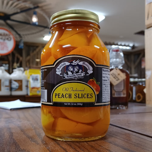 Handcrafted glass jar of old-fashioned peach slices in natural syrup with a metal lid, made in USA, featured in Kitchen & Food, Food, Pantry, USA Made, Best Sellers, Promo Eligible collections.