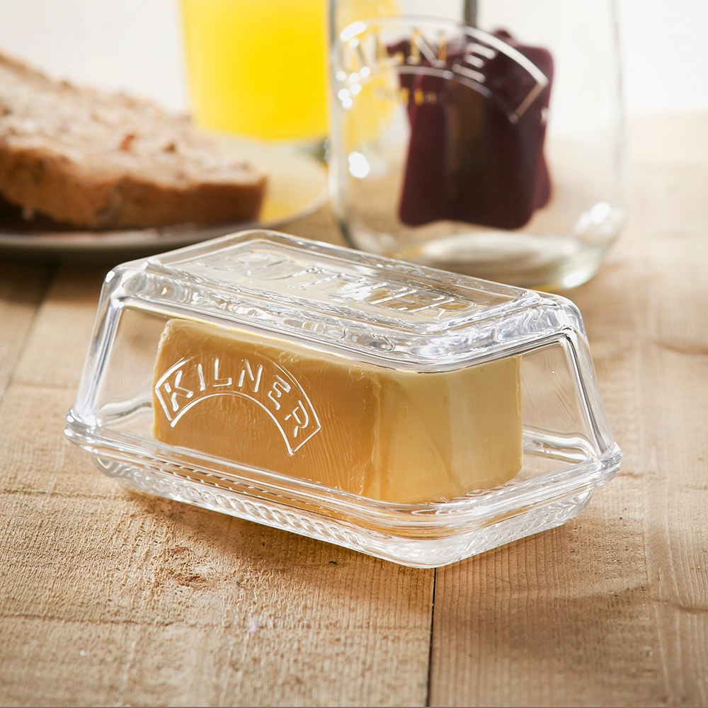 Clear glass butter dish embossed with the "Kilner" logo, designed for storing and serving butter, featured in Kitchen & Food, Specialty Equipment, and Making Butter collections.