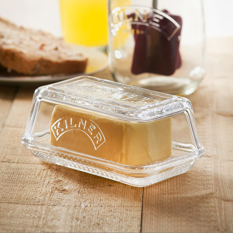 Clear glass butter dish embossed with the "Kilner" logo, designed for storing and serving butter, featured in Kitchen & Food, Specialty Equipment, and Making Butter collections.