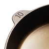 Close-up of a handcrafted cast iron skillet marked with the number 10, showcasing its smooth cooking surface and lightweight design, made in the USA for Kitchen & Food, Camping, and Cast Iron collections.