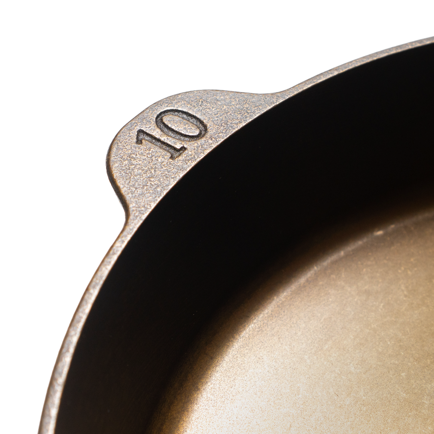 Close-up of a handcrafted cast iron skillet marked with the number 10, showcasing its smooth cooking surface and lightweight design, made in the USA for Kitchen & Food, Camping, and Cast Iron collections.