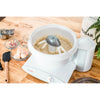 White mixer bowl with cake batter being mixed by lightweight paddle attachments designed for Bosch or NutriMill mixers, handcrafted in the USA for Kitchen & Food and Baking Supplies collections.