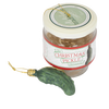 Glass jar containing a festive green pickle-shaped ornament with a gold hanging string, designed for holiday decor and celebrated as a fun seasonal tradition in home collections.