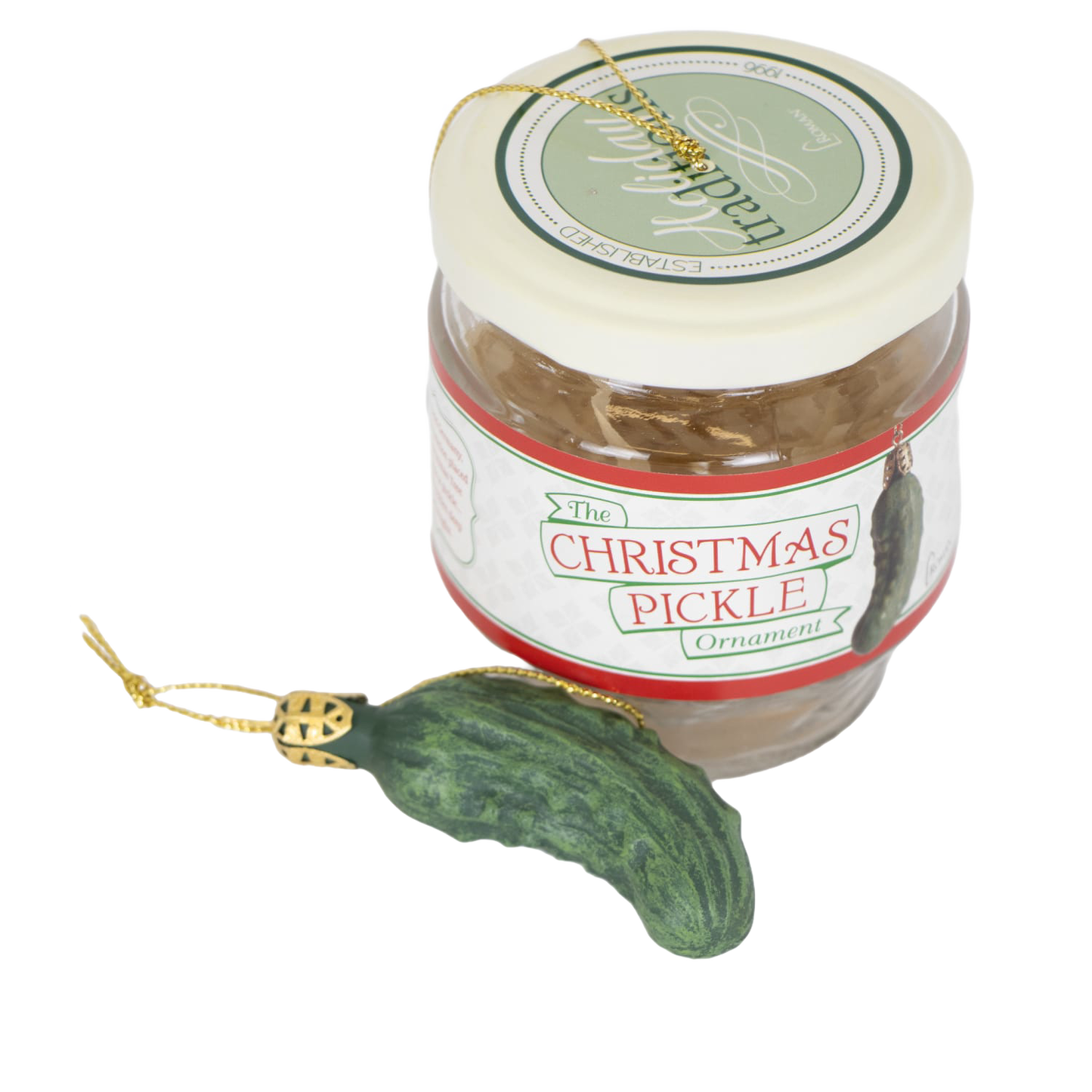 Glass jar containing a festive green pickle-shaped ornament with a gold hanging string, designed for holiday decor and celebrated as a fun seasonal tradition in home collections.